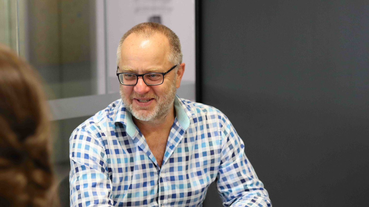 Patrick Fensham sitting at a desk